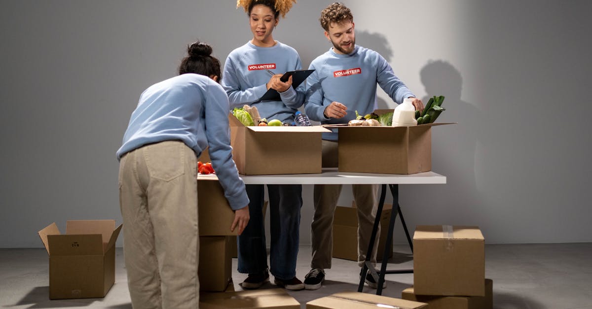 Volunteers sorting and packing donated tins, pasta and long-life milk at a community food bank, showing in practical terms what do food banks do.